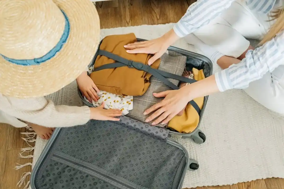 Packing a suitcase with child
